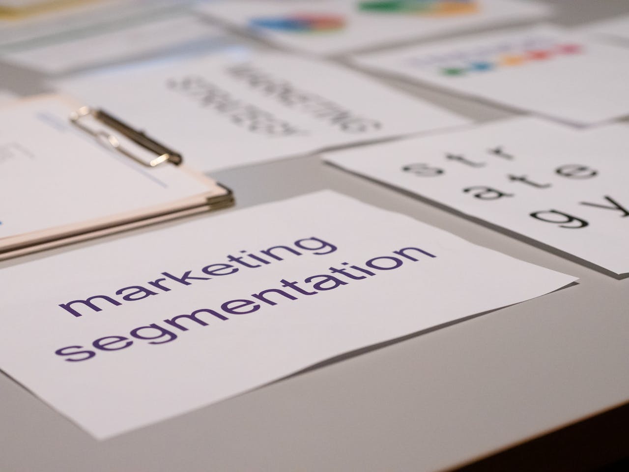 about-01 Close-up of various marketing documents on a desk, perfect for business and strategy discussions.